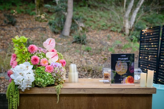 Flower arrangement and drinks menu on the courtyard bar