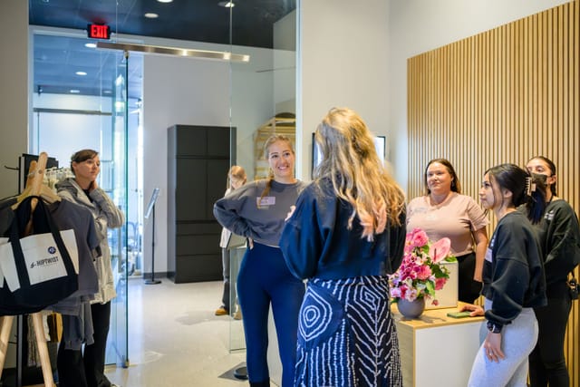 Guests chatting at the front desk in the studio lobby