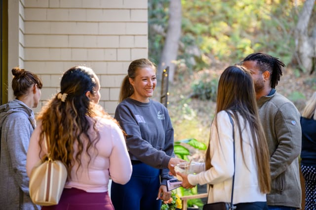 Guests greeting each other in the courtyard
