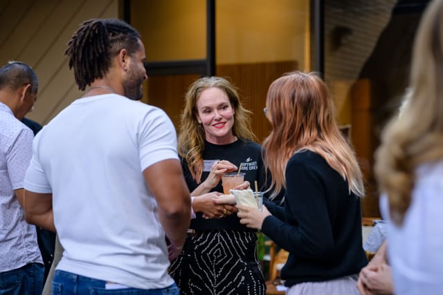 Guests laughing together outside the studio