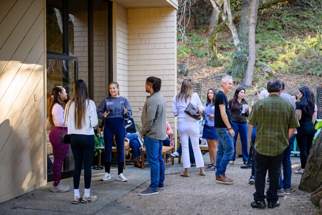 A crowd gathering in the courtyard outside the studio