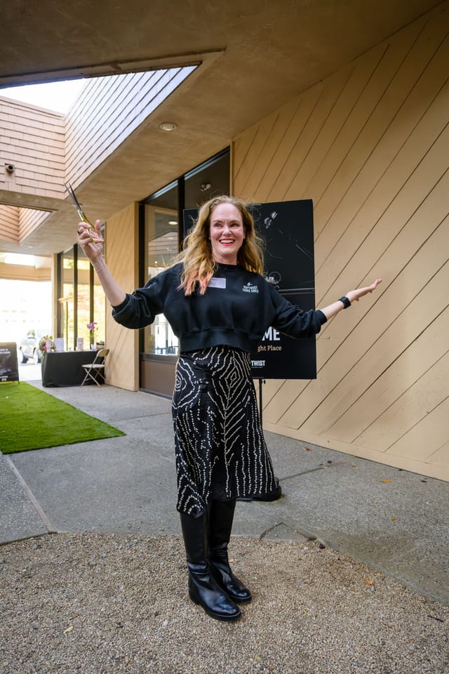 Scissors raised in celebration after the ribbon cutting