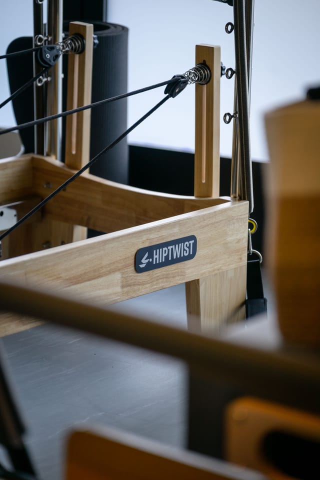 Close-up of a reformer&rsquo;s wooden frame and ropes