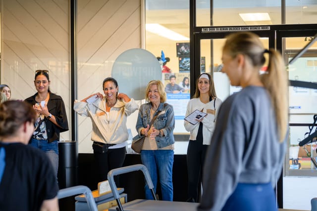 Guests touring the reformer room