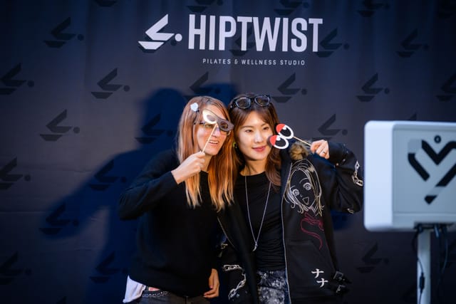Two guests with sunglasses props at the photo booth