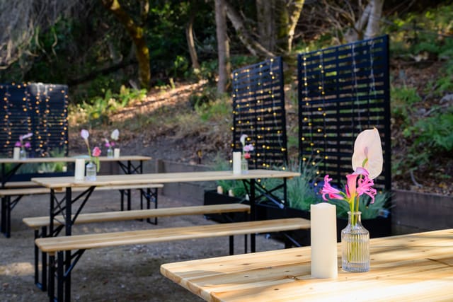Candlelit tables in the courtyard as evening falls