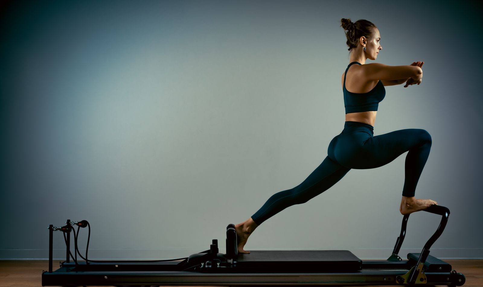 Pilates practitioner on a reformer